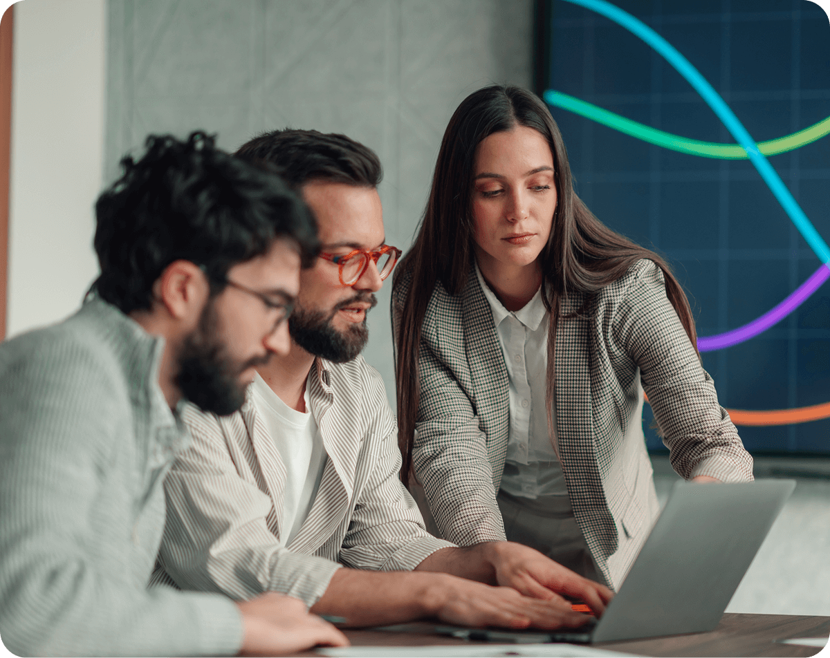 Team collaborating on laptop