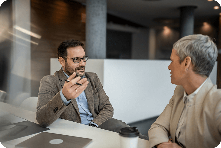 Two professionals discussing in an office