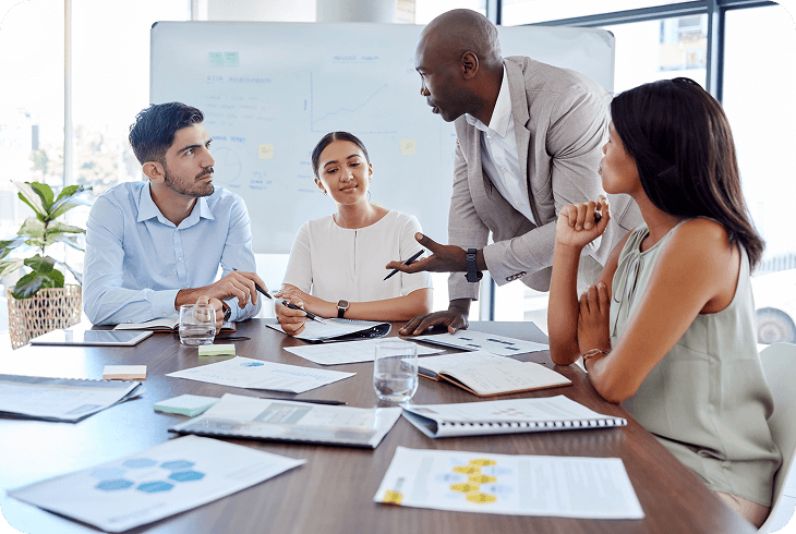 Colleagues collaborating around conference table