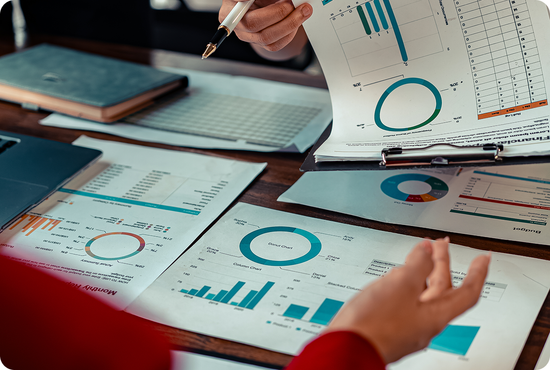 Business meeting with financial charts